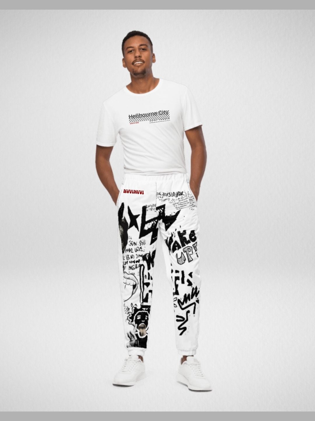 White graffiti joggers worn from the front, black print down the full leg.